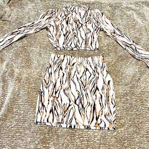2 piece white with brown and blacked striped skirt outfit.